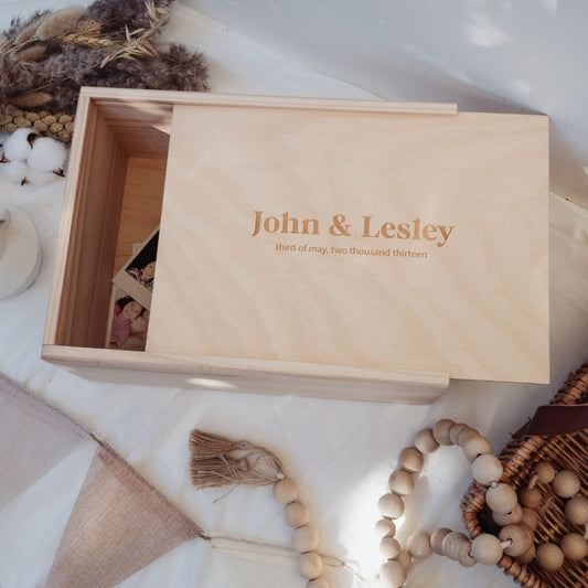 This is a large wooden wedding keepsake box with a plain text design and a date of the wedding underneath
