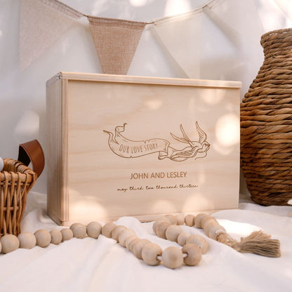 Wooden Wedding Keepsake Box with a design of a flying bird holding a banner which says "our love story". Personalised name and other details can be added